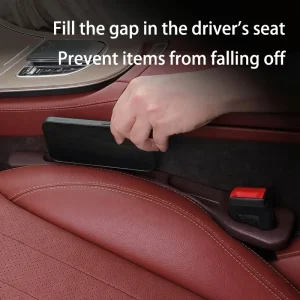 Car seat gap filler next to the driver's seat with a phone resting on it